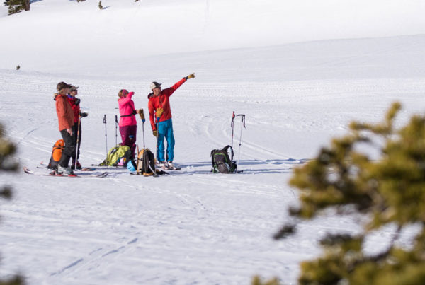 Private AIARE Course group stops during a ski tour